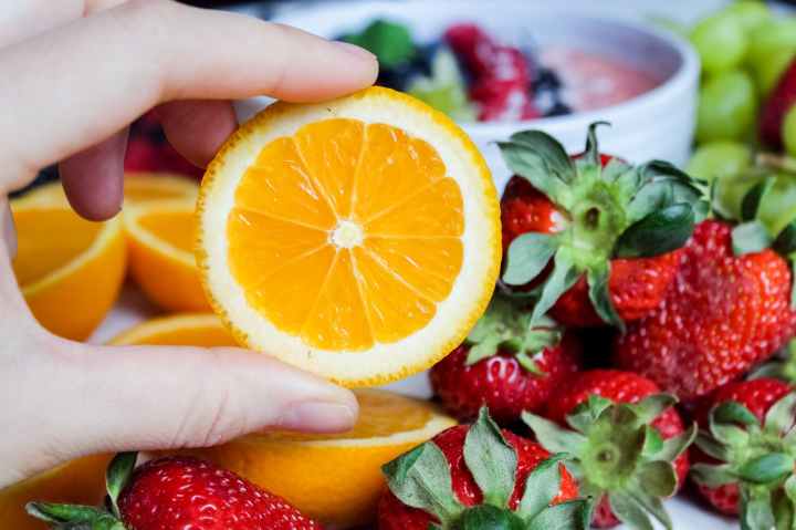 slice orange fruit and strawberries